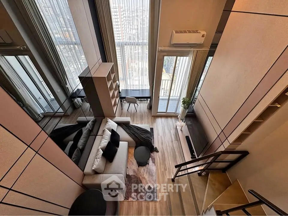 Stunning modern living room with high ceilings and panoramic city views, featuring elegant decor and cozy seating.