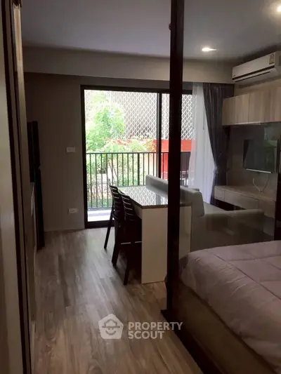 Modern studio apartment with balcony and stylish interior design