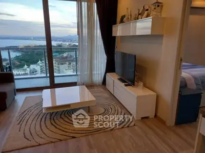 Modern living room with stunning ocean view and stylish decor