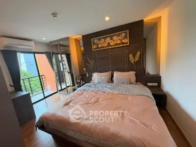 Luxurious bedroom with balcony and modern decor in a high-rise apartment