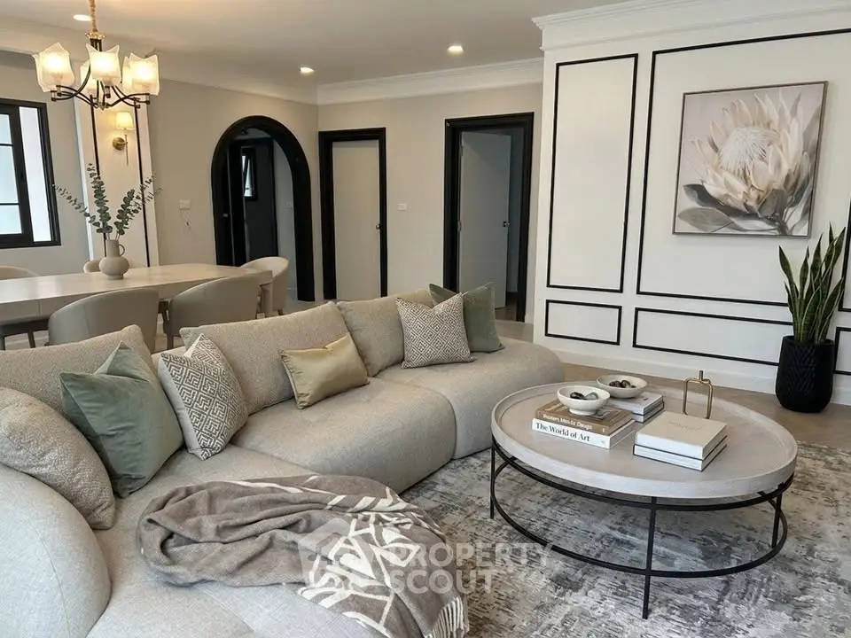 Luxurious living room with elegant decor and cozy seating in modern apartment.