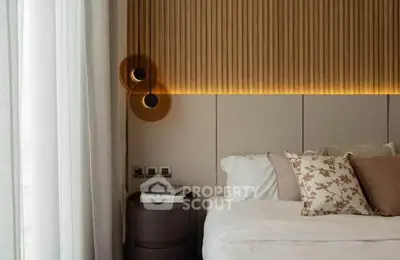Luxurious bedroom with modern lighting and elegant decor