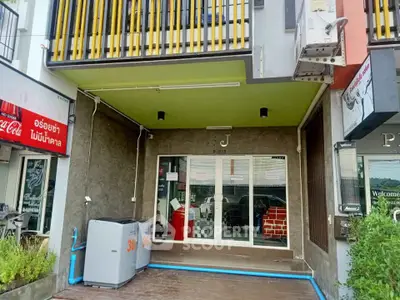 Modern commercial property with stylish facade and large glass entrance in vibrant area.