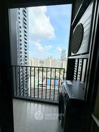 High-rise balcony with stunning cityscape view and modern appliances.