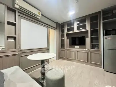 Modern living room with built-in shelves and sleek furniture in a stylish apartment.