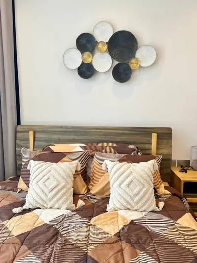 Cozy bedroom with stylish wall art and modern bedding