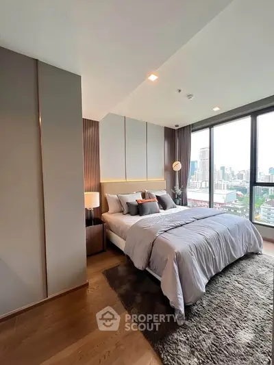 Luxurious bedroom with stunning city view and modern decor