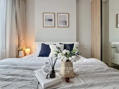 Elegant bedroom with cozy decor and natural light, perfect for relaxation and comfort.