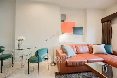Stylish modern living room with leather sofa and chic decor