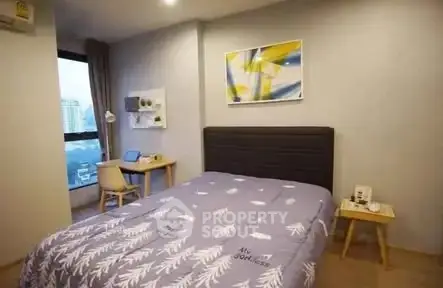 Cozy bedroom with modern decor and city view window