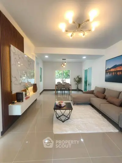 Spacious modern living room with elegant decor and natural lighting