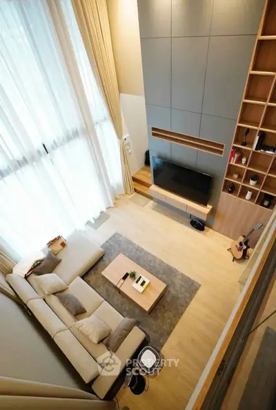 Spacious modern living room with high ceilings and elegant decor