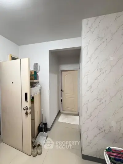 Cozy apartment entrance with modern decor and storage solutions