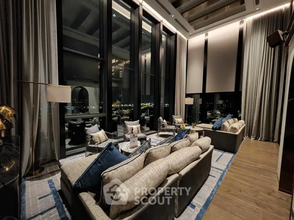 Luxurious high-ceiling living room with stunning city view and elegant decor
