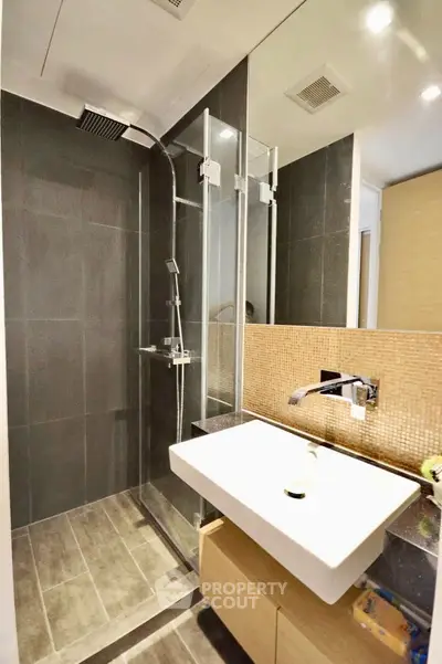 Modern bathroom with sleek shower and stylish sink in contemporary design
