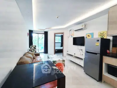 Modern living room with open layout, stylish furniture, and natural light.