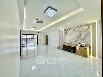 Spacious modern living room with marble flooring and elegant lighting