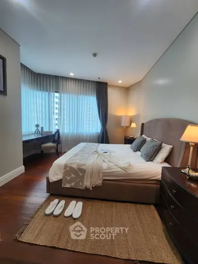 Luxurious bedroom with elegant decor and natural light in prime real estate location.