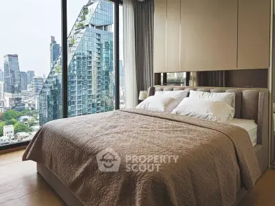 Luxurious bedroom with stunning city view in modern high-rise apartment