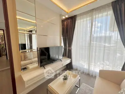Modern living room with stylish decor and large window offering city view.