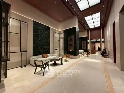 Luxurious modern lobby with elegant seating and sophisticated design elements.