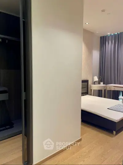 Modern bedroom with sleek design and wooden flooring