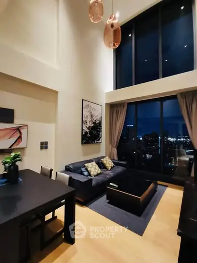 Luxurious high-ceiling living room with city view and modern decor