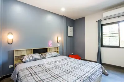 Modern bedroom with stylish decor and natural light