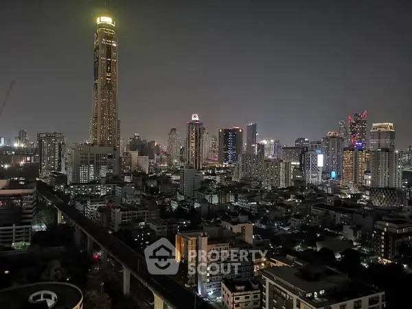 Stunning nighttime cityscape with illuminated skyscrapers and vibrant skyline.