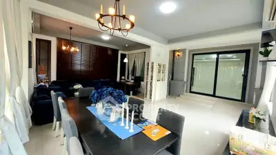 Spacious living and dining area with elegant decor and ample natural light.