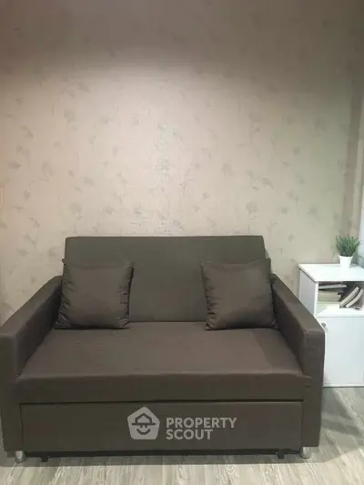 Cozy living room with a stylish brown sofa and modern decor