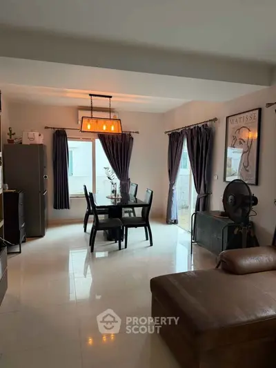 Spacious living room with modern dining area and elegant decor