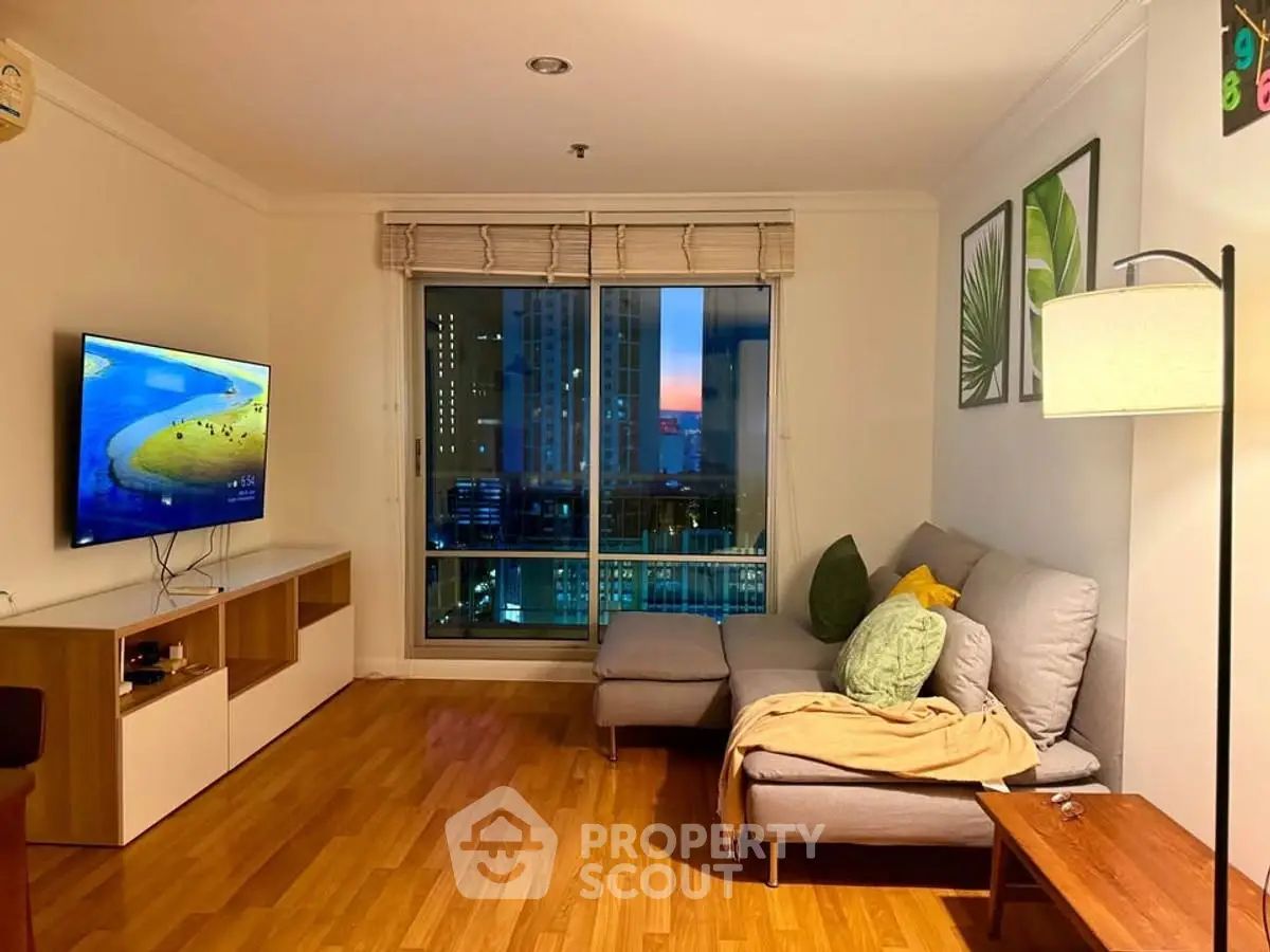 Cozy living room with city view, modern decor, and comfortable seating.