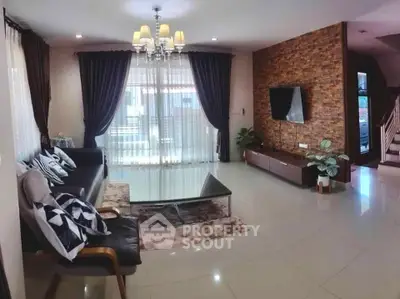 Spacious living room with modern decor and large windows for natural light.