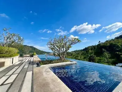 Stunning infinity pool with panoramic mountain views and lush greenery.