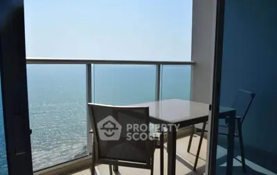 Stunning ocean view from a modern balcony with sleek furniture, perfect for relaxation and enjoying the sea breeze.