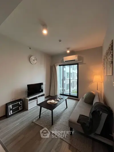 Modern living room with balcony view and stylish decor