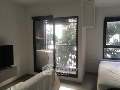 Cozy living room with balcony view and natural light