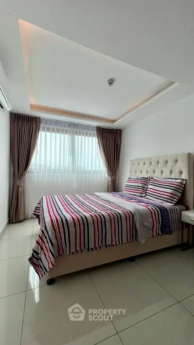 Modern bedroom with stylish decor and natural light