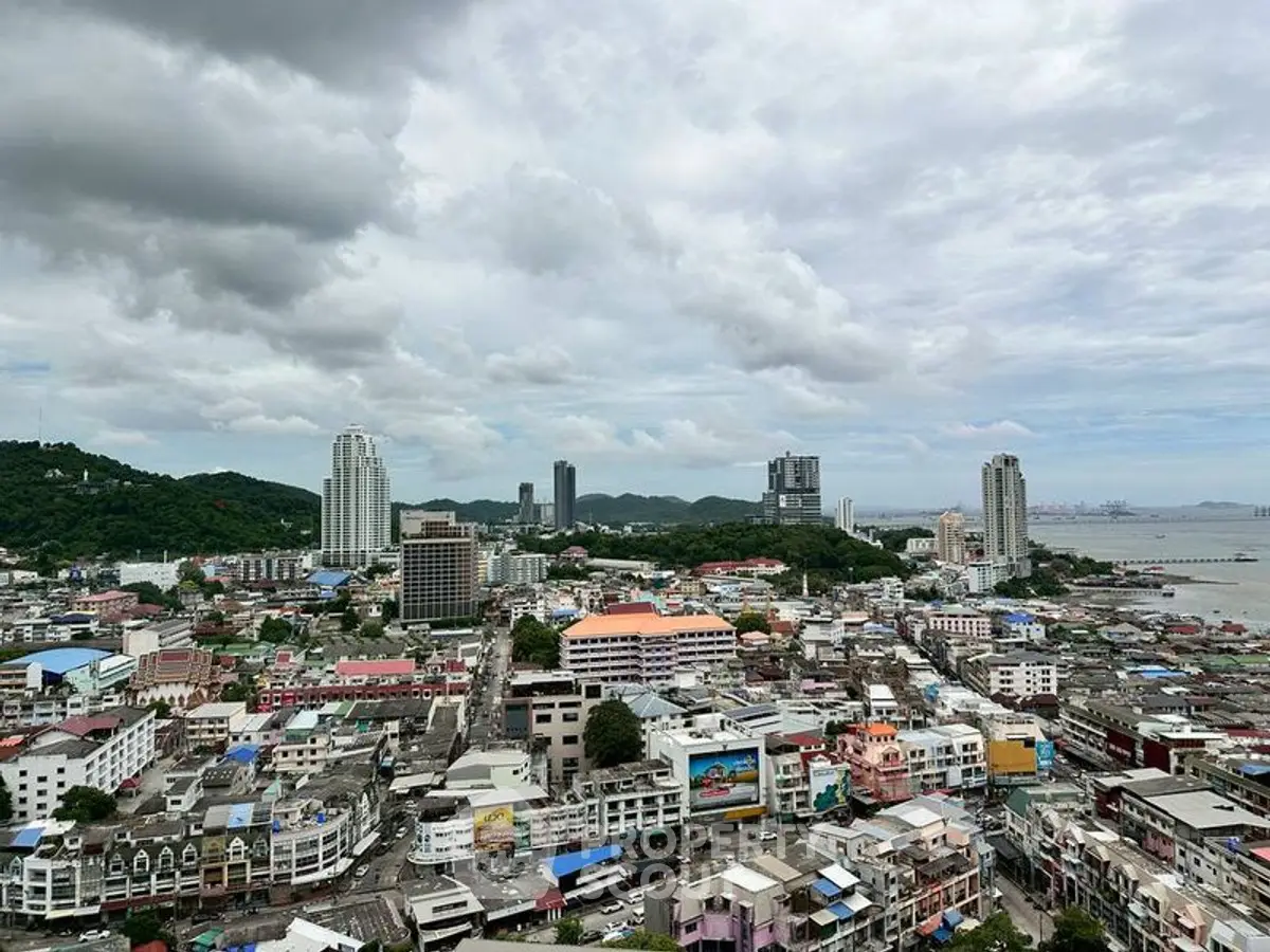 Stunning cityscape view showcasing high-rise buildings and scenic ocean backdrop, perfect for urban living enthusiasts.