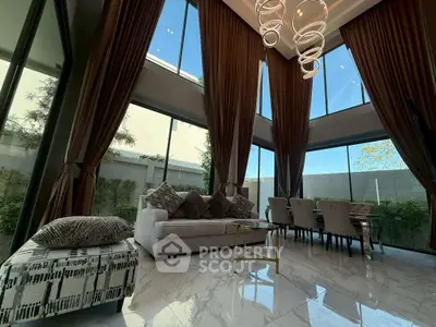 Luxurious modern living room with high ceilings and elegant decor