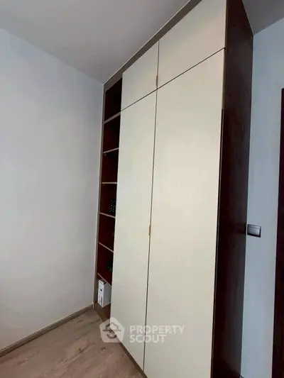 Modern built-in storage unit with sleek design and ample shelving space.