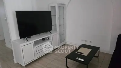 Modern living room with sleek TV setup and minimalist decor