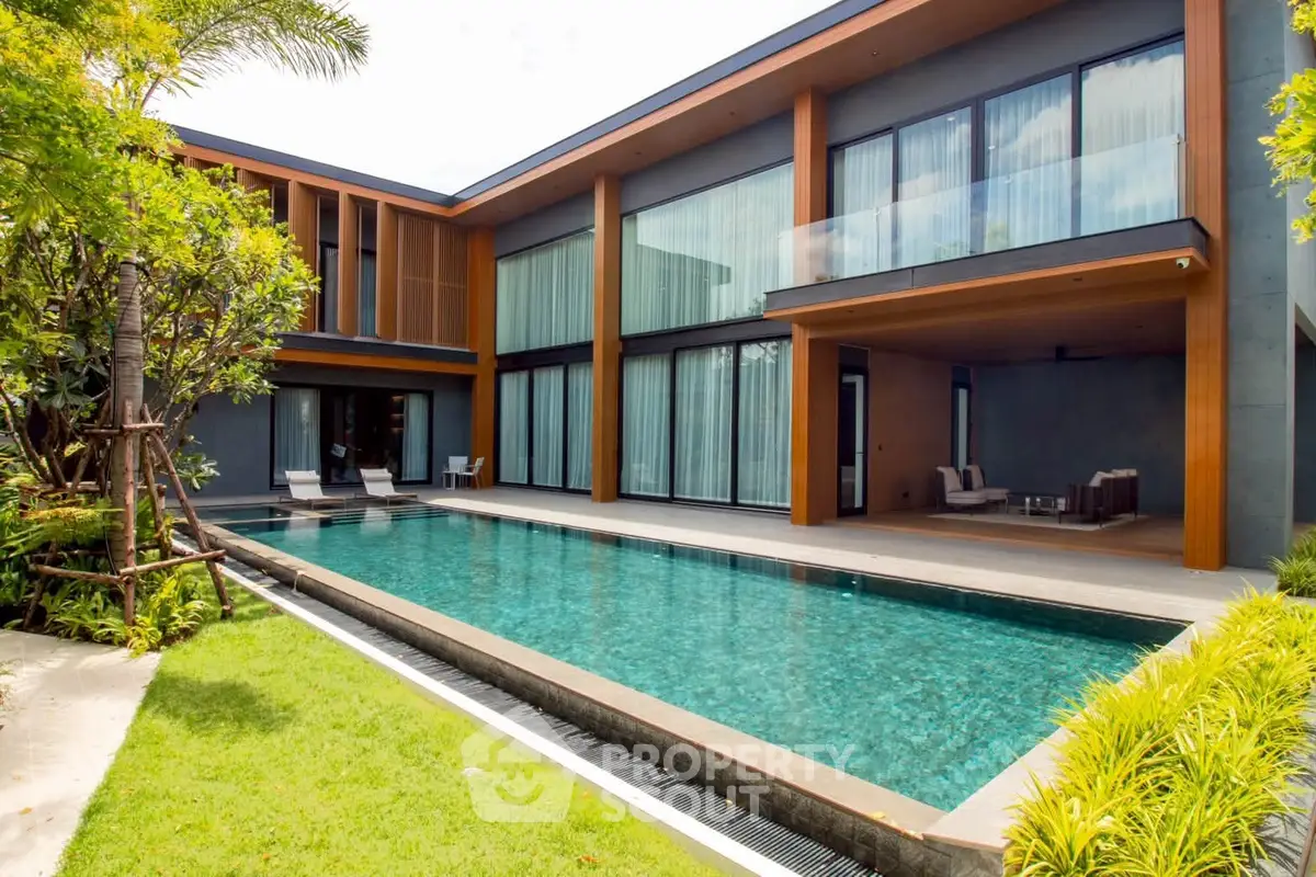 Luxurious modern villa with private pool and lush garden, perfect for relaxation and entertainment.