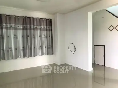 Spacious empty room with glossy tiled floor and elegant curtains, perfect for customization.