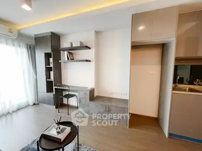 Modern living room with sleek built-in shelves and cozy workspace