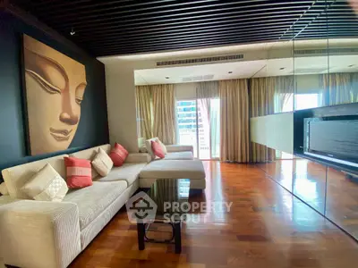 Luxurious living room with modern decor and large windows offering stunning city views.