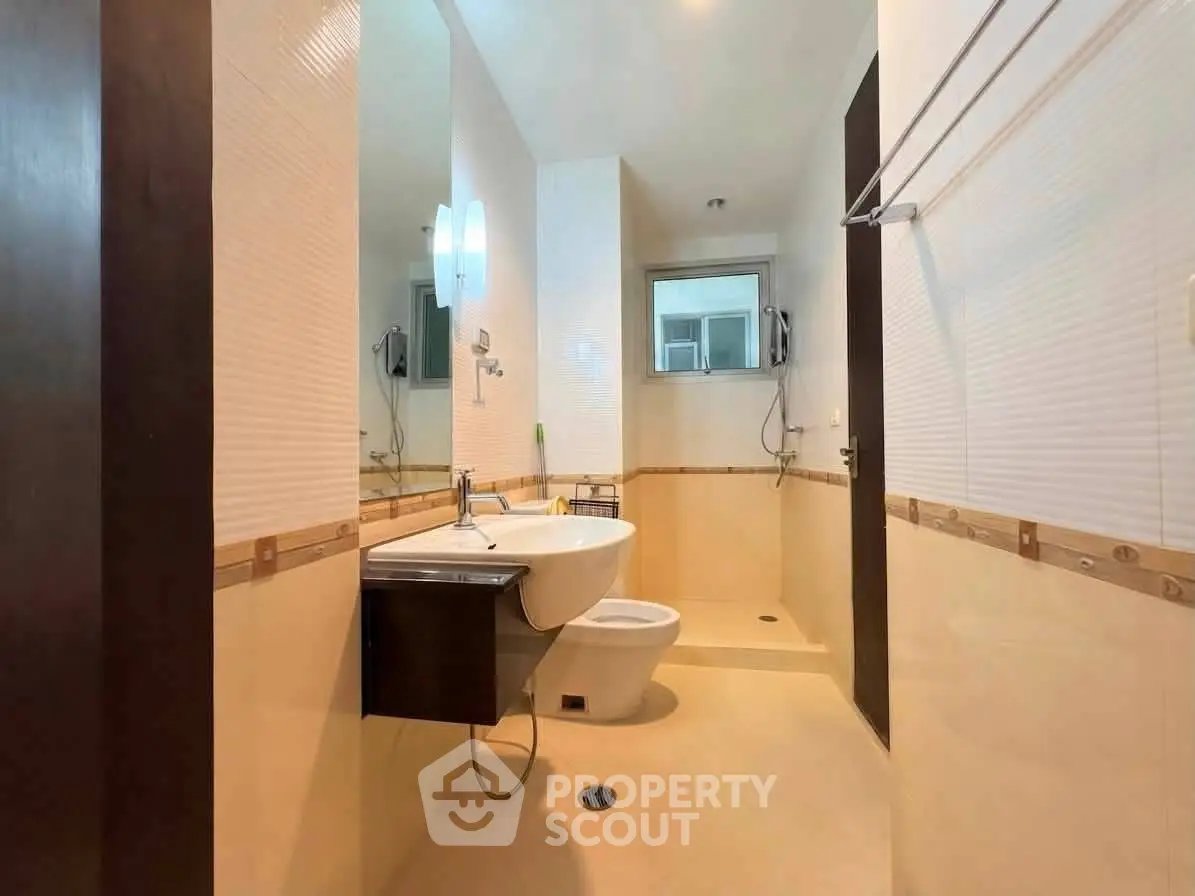 Modern bathroom with sleek fixtures and spacious shower area