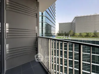 Modern balcony with sleek railing and urban view in high-rise building