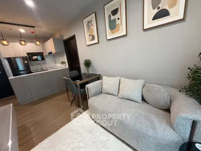 Modern living room with stylish decor and open kitchen layout